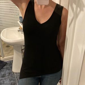 Asymmetrical black tank top with leather detailing